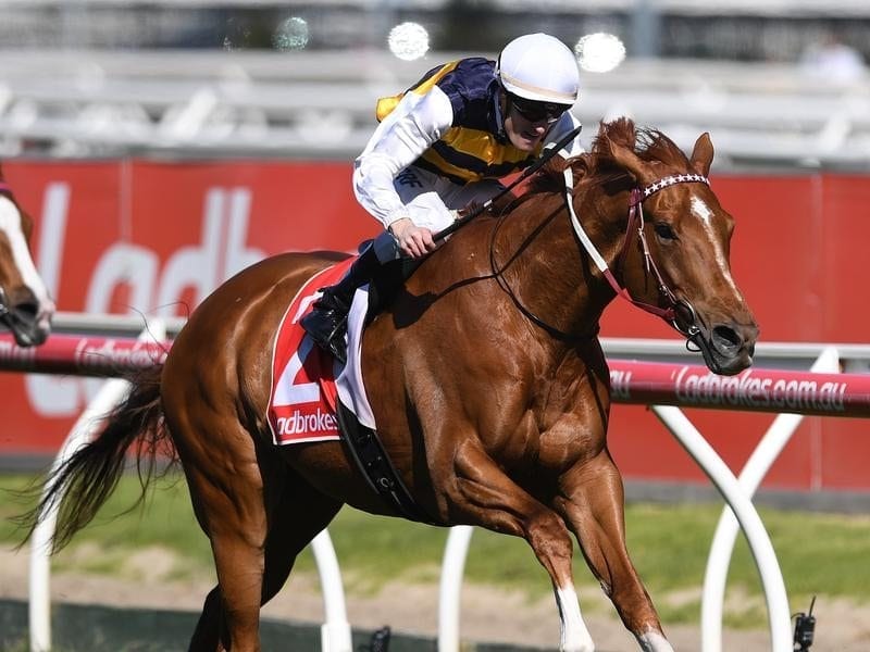 Mark Zahra rides Gailo Chop (right) to victory in the Caulfield Stakes